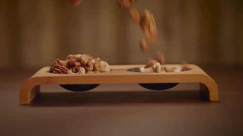 Nuts Poured onto a Wooden Snack Tray