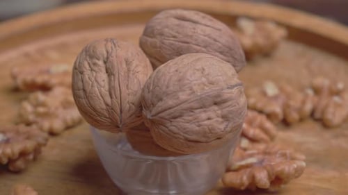 Walnuts in Bowl on Wood Tray, Close Up