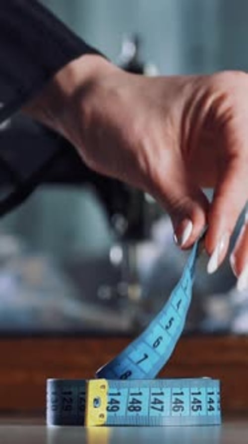 Tape Measure Twisting Upward Near Sewing Machine