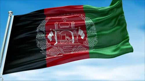Waving Afghanistan National Flag Against a Clear Blue Sky