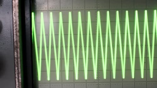 Vintage Oscilloscope with Green Signal