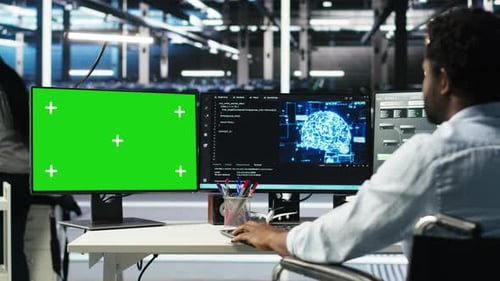 Data Center Engineer with Paraplegia Using AI Algorithms on Green Screen PC