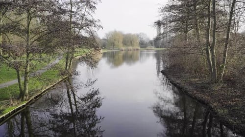 A beautiful park in the netherlands during a sunny winter day with spring colors. Steady shot