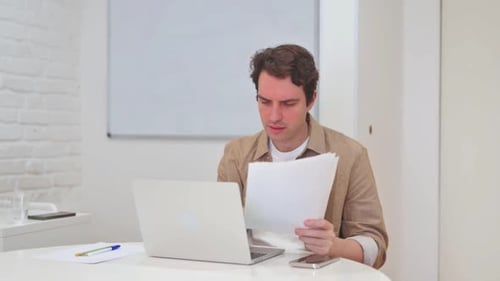 Man Working at Desk in Bright Modern Office