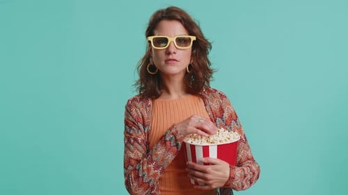 Woman Eats Popcorn in 3D Glasses
