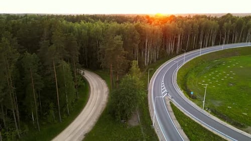 Aerial View of Sunset Over Forest Road and Highway Intersection Capturing Natures Beauty in the