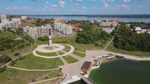 Enjoy a Breathtaking Aerial View of a Monument and Urban Landscape with a Waterfront Setting