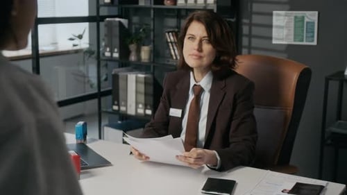 Official Reviews Documents and Passport with Young Woman