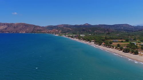 Aerial View of Crete Coastline with Sandy Beach and Turquoise Waters