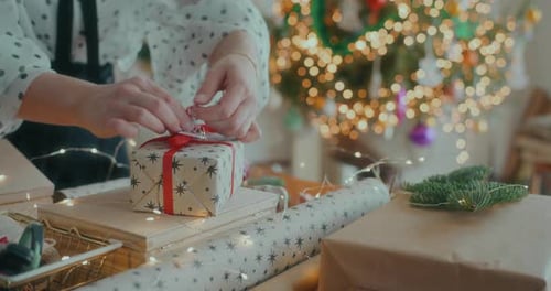 Joyful Woman Decorating Wrapping Christmas Gifts For Xmas Holidays
