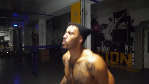 Strong African Athlete with Tattoos Skipping with a Jump Rope at Sport Club Young Black Sporty Man