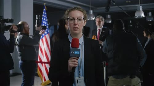 Confident Reporter Speaks at Press Conference