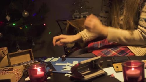 Festive Holiday Crafting with Dog near Christmas Tree