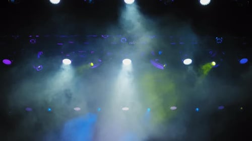 Vibrant Stage Lights Illuminating Haze at Concert