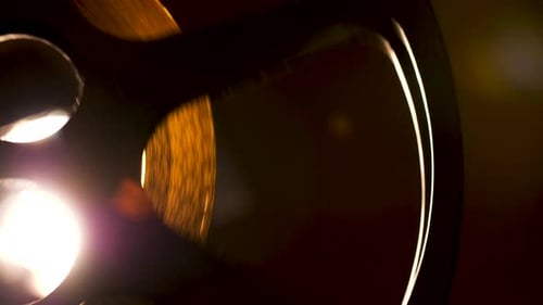 Vintage Film Reel Spinning in Bright Light
