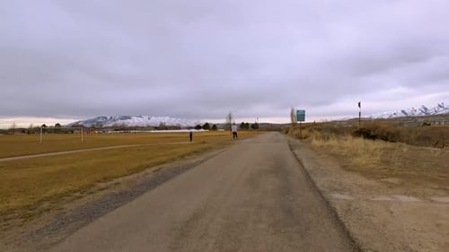 Hyperlapse from the point of view of a cyclist riding along a scenic naturel trail along a river in