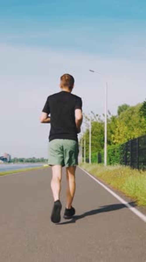 Running Track Runner Man Running in City Park Unrecognizable Man Back View Running Cardio Training