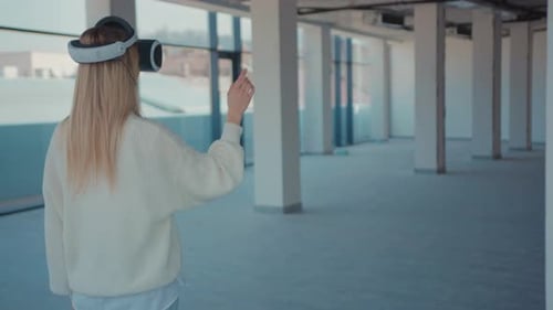 Shot Back Woman Using Making Gestures Swipe When Wearing Virtual Reality Empty Building Looks How