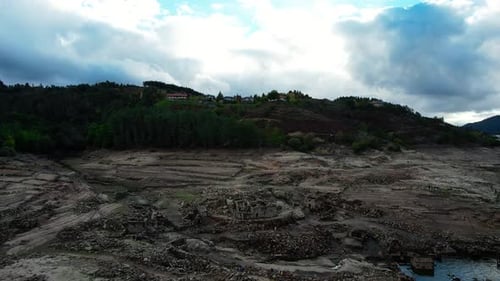 Climate change: Arid and desolate area with destroyed buildings