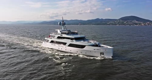 Aerial View Tracking of Beautiful Modern White Superyacht Lifestyle Luxury Boat Sailboat