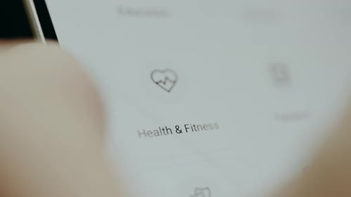Health and Fitness App on Tablet Close Up Zoom