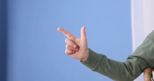 Child's Hand Making Finger Gun Gesture