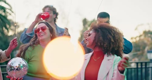 Friends Celebrate With Sparklers and Disco Ball Outdoors