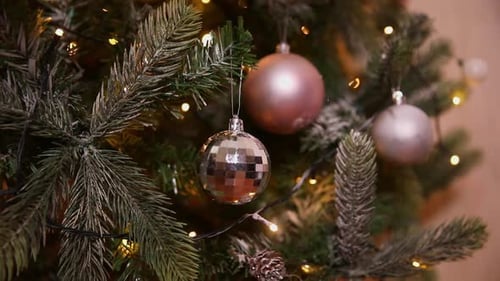 Christmas Tree Close-Up with Shimmering Ornaments and Lights