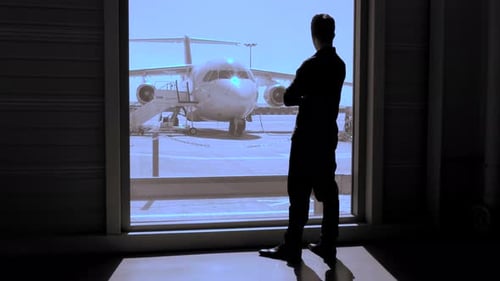 Business Passenger Waiting Inside Airport Gate for Airplane Flight Boarding
