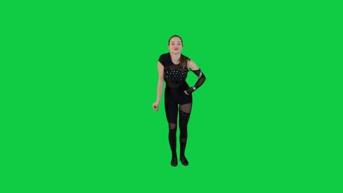 Slow motion female dancer performance in front of the green screen wearing a black outfit