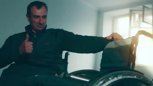 A Disabled Man Assembles a Stroller