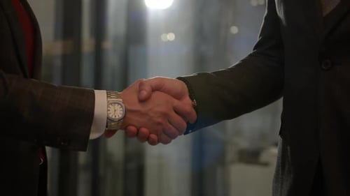 Executive Managers Shake Hands Making Business Deal
