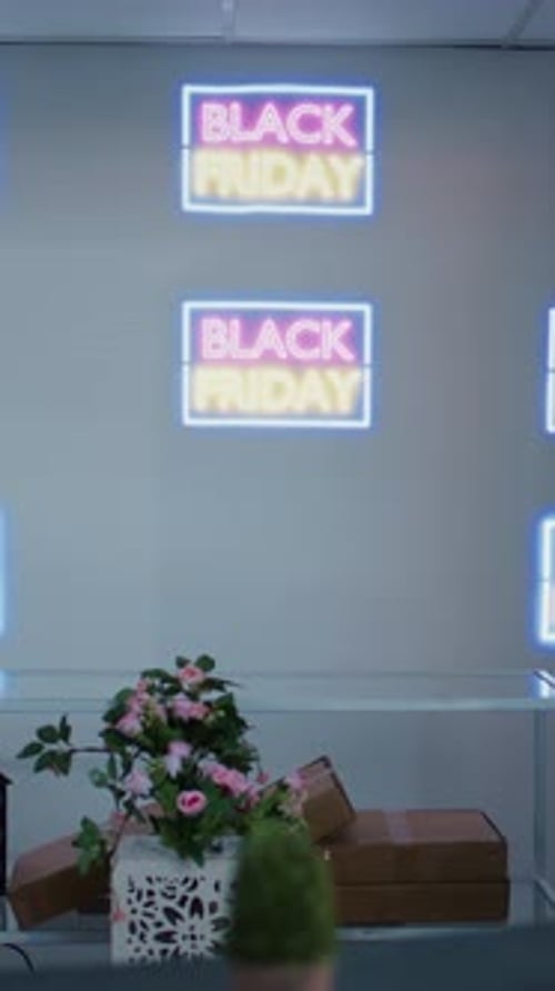 Black Friday Neon Display with Festive Decorations