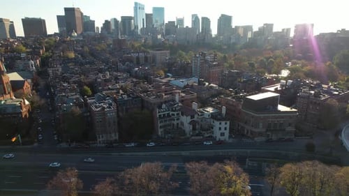 The Boston, Massachusetts's city skyline at sunrise - ascending aerial view