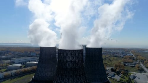 Metallurgical plant spewing fumes near megapolis aerial view of industrial pollution