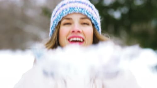 People, Season and Christmas Concept - Happy Young Woman in Winter Forest