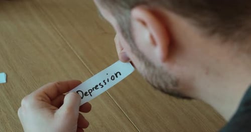 Man Looking at Depression Word – Mental Health Concept
