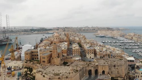 Grand Harbour of Valetta beneath the Three Cities, in Malta - Orbit aerial shot
