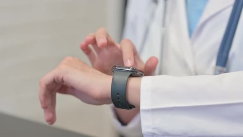 Close up of Female Doctor using Smart Watch