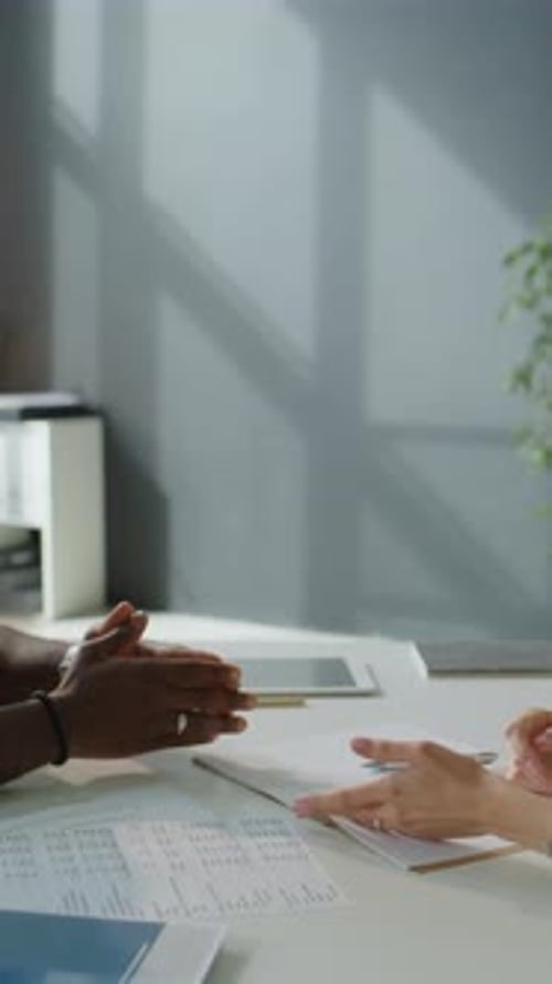 Close Up of Colleagues Shaking Hands on Office Meeting