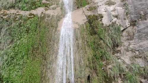 Beautiful natural waterfall falling down the hills in mountain area
