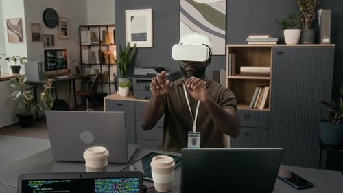 Man Wearing VR Headset Interacting with Virtual Environment
