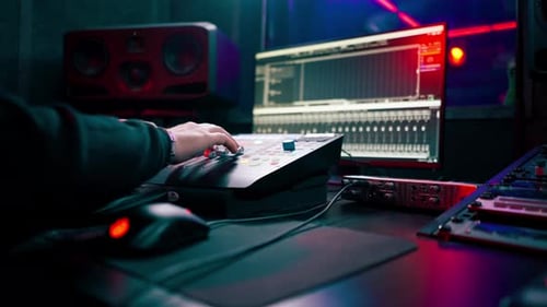 Close Up the Recording Room Dark with Neon Lighting in the Studio the Sound Engineer Works with the