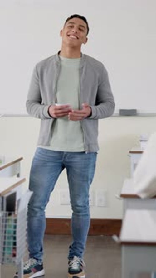 Assignment, laughing and presentation with student man in classroom of college for speech