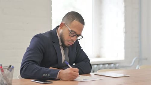 Man in Suit Working in an Office