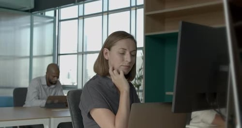Businesswoman working in a coworking office space