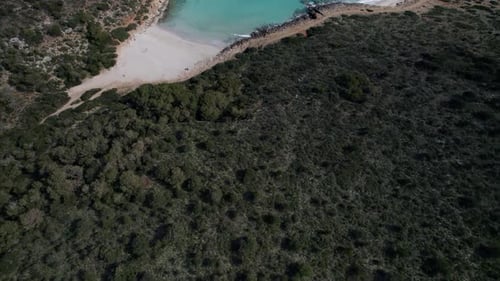 Aerial view of tranquil beach and bay in Mallorca, Spain.