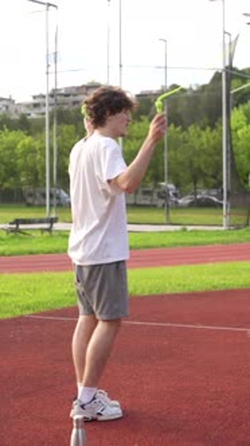 Young Man Skipping Rope on Sunny Day
