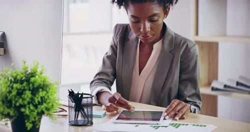 4k video footage of a young attractive businesswoman working in her office