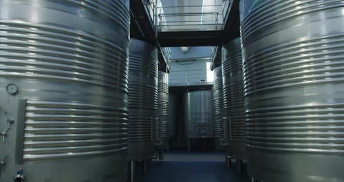 Amazing shot inside a wine factory inside large metal containers in southern Spain
